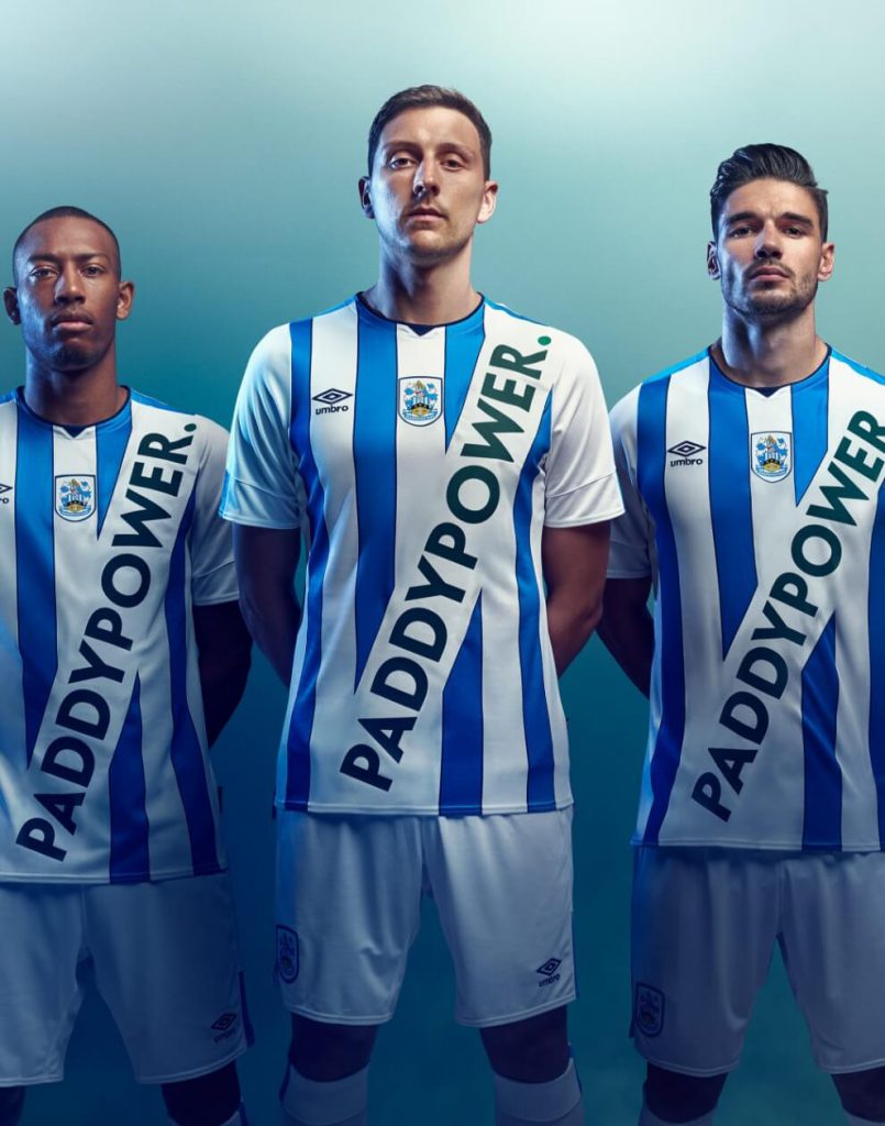 Three football players wearing Paddy Power kits