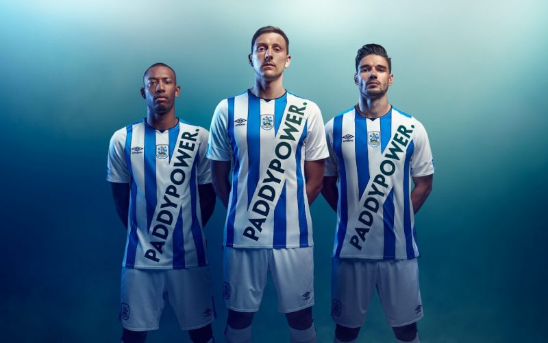 Three football players wearing Paddy Power kits