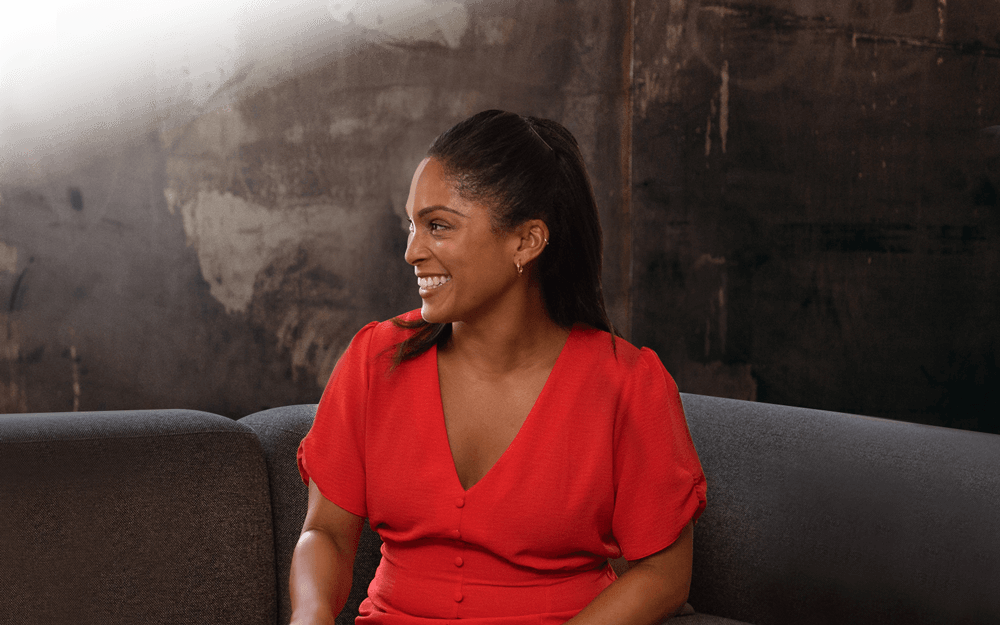 Woman smiling on sofa