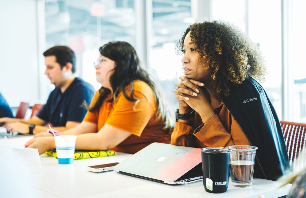 Octagon staff in a meeting together